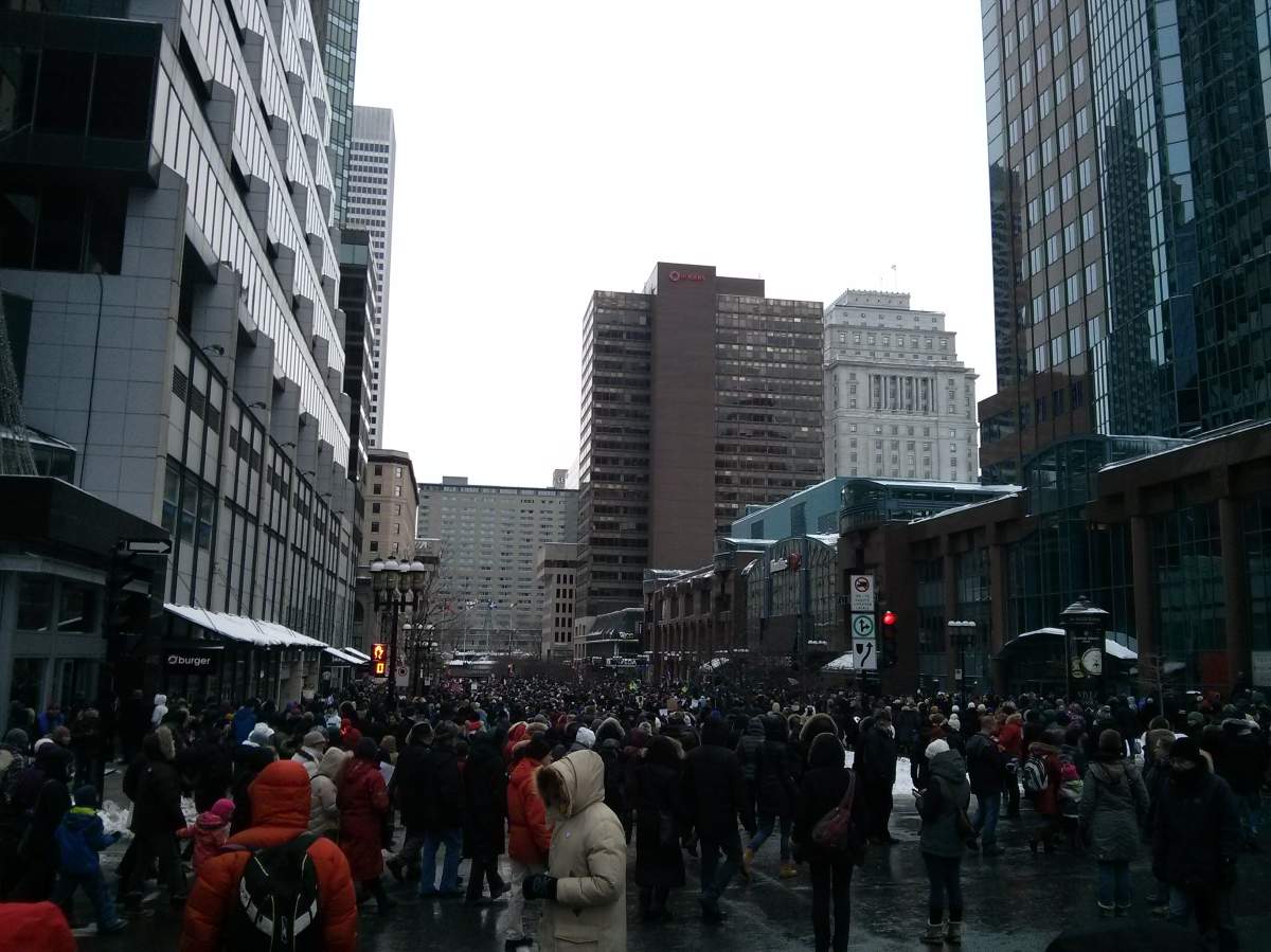 Montrealers march to the French consulate on Mcgill avenue.