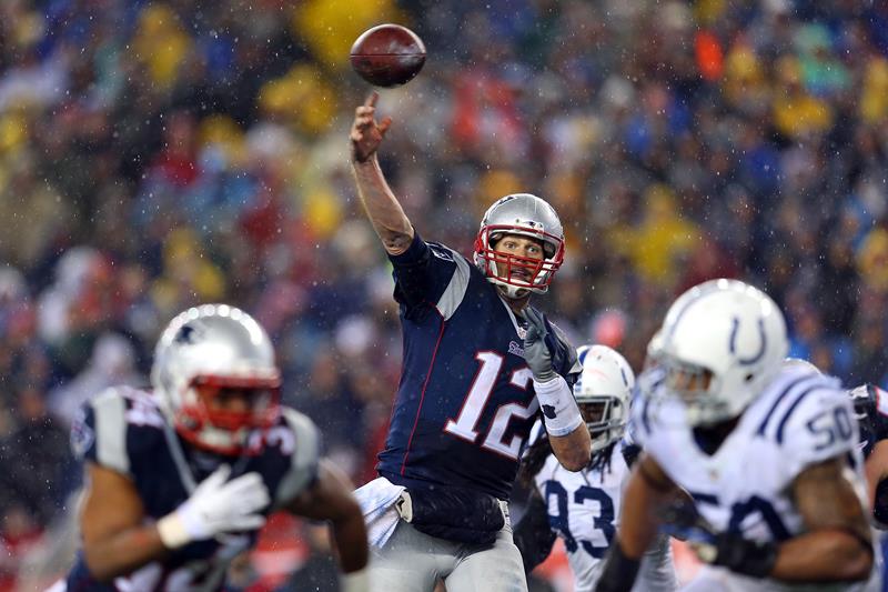 Tom Brady of the New England Patriots throws a touchdown pass to Rob Gronkowski #87 (not pictured) in the third quarter against the Indianapolis Colts of the 2015 AFC Championship Game at Gillette Stadium on January 18, 2015 in Foxboro, Massachusetts. 