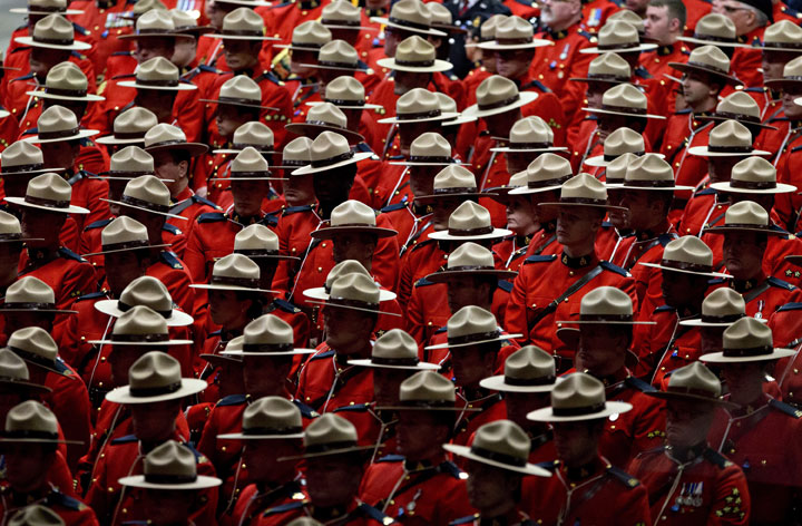 RCMP officers attend the funeral procession for slain RCMP Constable David Wynn, in St. Albert, Alta., on Monday, January 26, 2015.