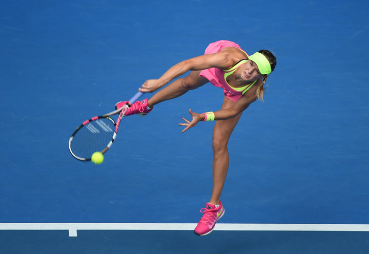 Canada's Eugenie Bouchard serves during her women's singles match against Russia's Maria Sharapova on Day 9 of the 2015 Australian Open in Melbourne on January 27, 2015. 