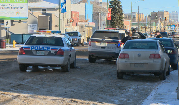 A woman reportedly pointed a handgun at an officer in Saskatoon Saturday afternoon.