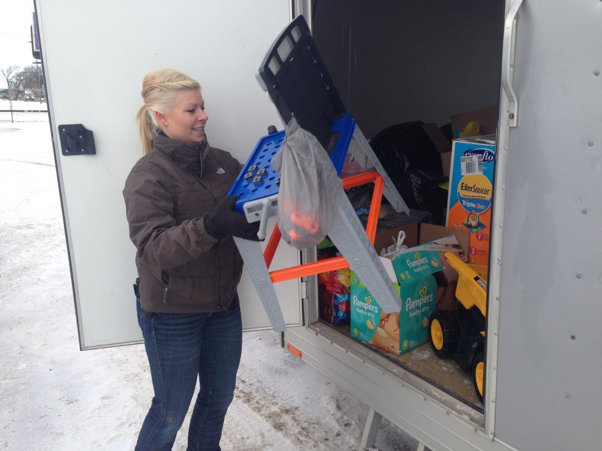 Const. Desiree Mills loaded up a trailer with a steady stream of donated toys on Sunday.
