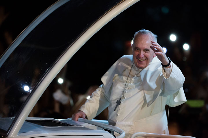 Pope Francis waves to the faithful upon his arrival in Manila city on January 15, 2015 in Manila, Philippines. 
