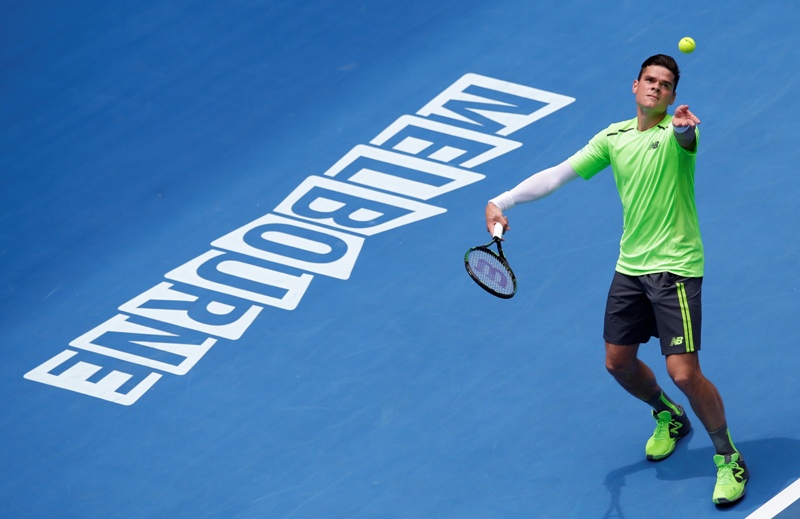 Milos Raonic of Canada serves to Illya Marchenko of Ukraine during their first round match at the Australian Open tennis championship in Melbourne, Australia, Tuesday, Jan. 20, 2015. 