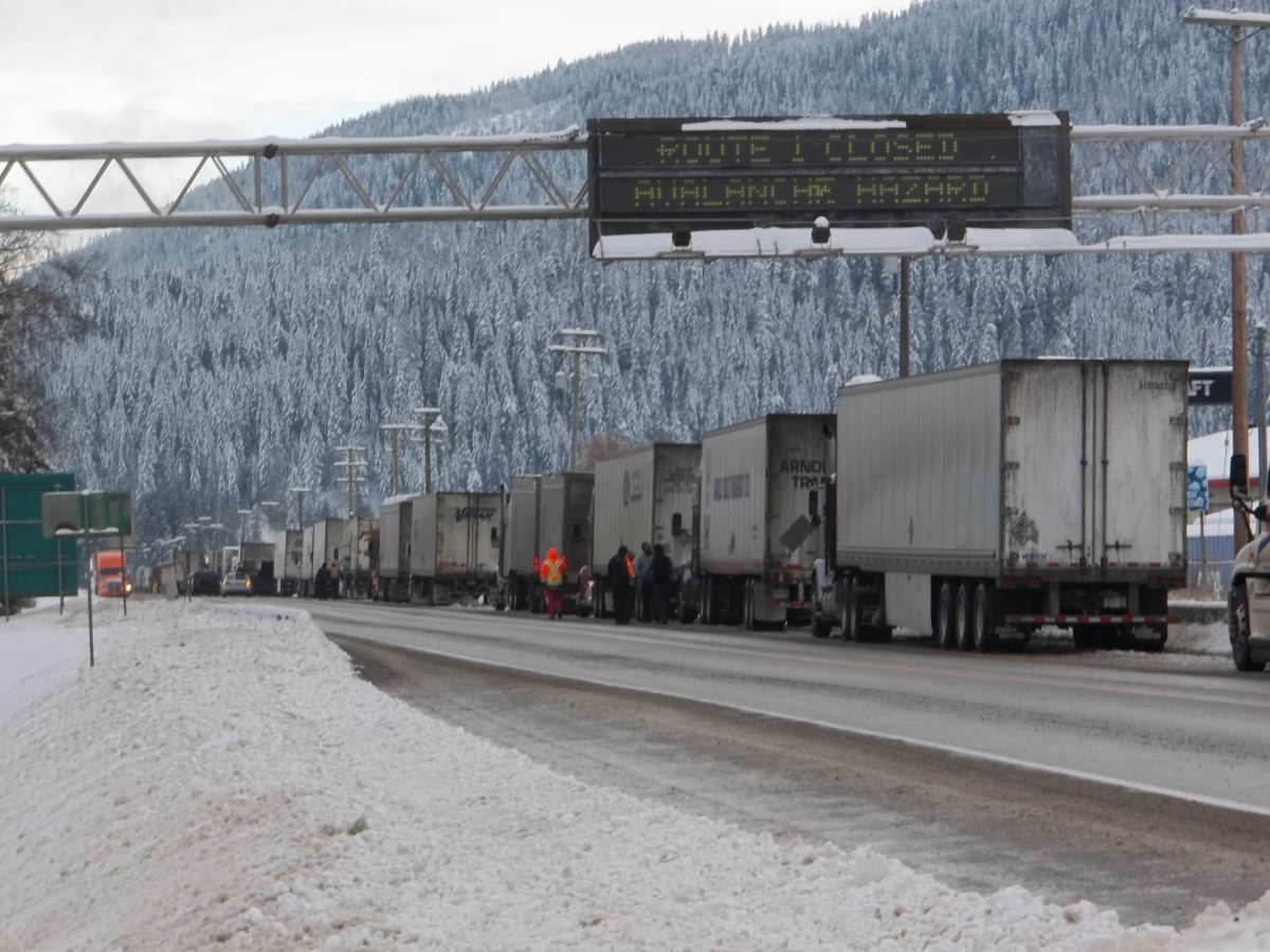 Semi trucks lined up along the Trans Canada Highway in Sicamous.