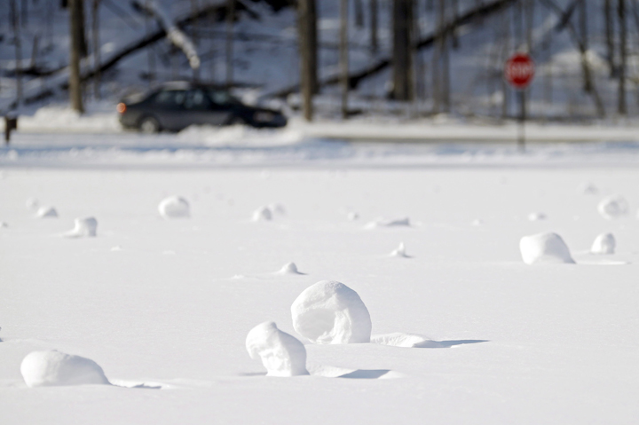 Snow rollers dot a field at the Cleveland Metroparks Mastic picnic area Tuesday, Jan. 28, 2014, in Fairview Park, Ohio.