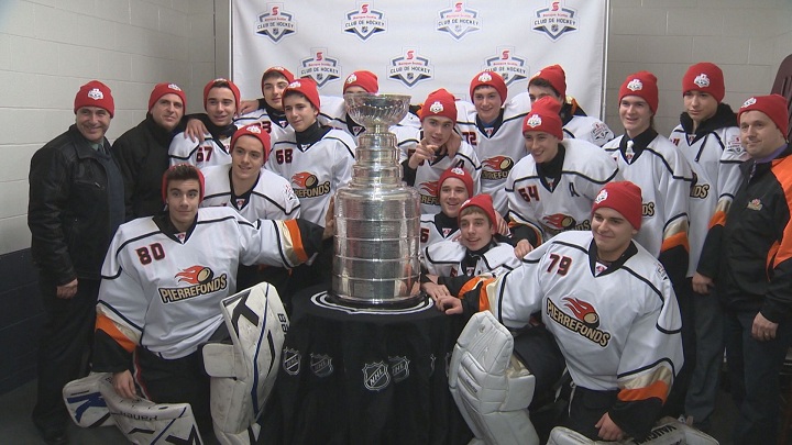 Members of the Pierrefonds Vicomtes Midget A hockey team pose with the Stanley Cup ahead of practice.  Jan. 28, 2015.