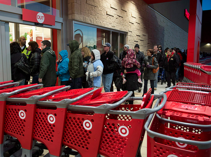 Shoppers enter a Target store in Dartmouth, N.S. in November. The retailer plans to lay off more than 17,000 workers as it exits Canada this year.