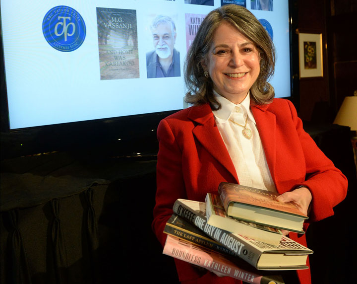 Noreen Taylor, founder of the RBC Taylor Prize, shows the five nominated books.
