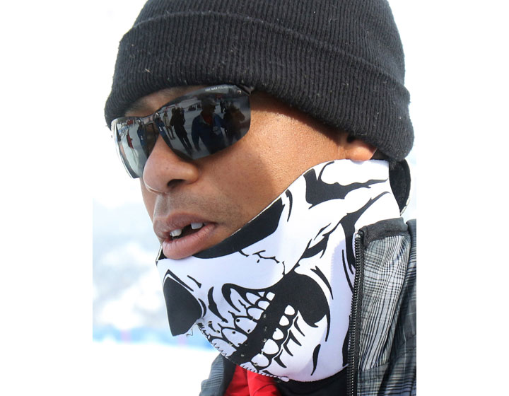 Tiger Woods walks in the finish area of an alpine ski, women's World Cup super-G, in Cortina d'Ampezzo, Italy, Monday, Jan. 19, 2015. 