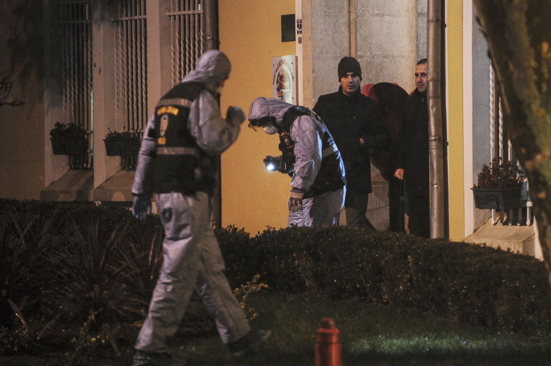 Crime scene investigation officers search for evidence after a female suicide bomber was killed on Jan. 6, 2015, when she blew herself up in an attack on the police station in the main tourist district of central Istanbul.