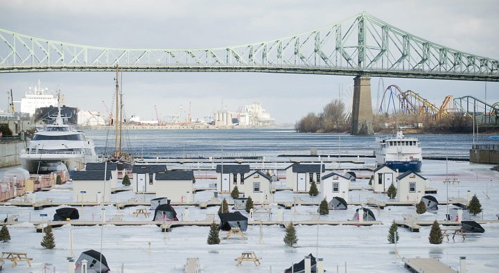An urban ice fishing village is shown in the Old Port of Montreal.