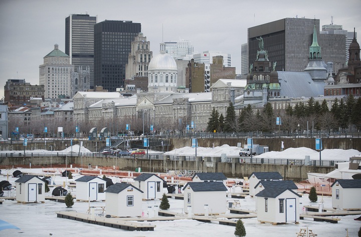 An urban ice fishing village is shown in the Old Port of Montreal.