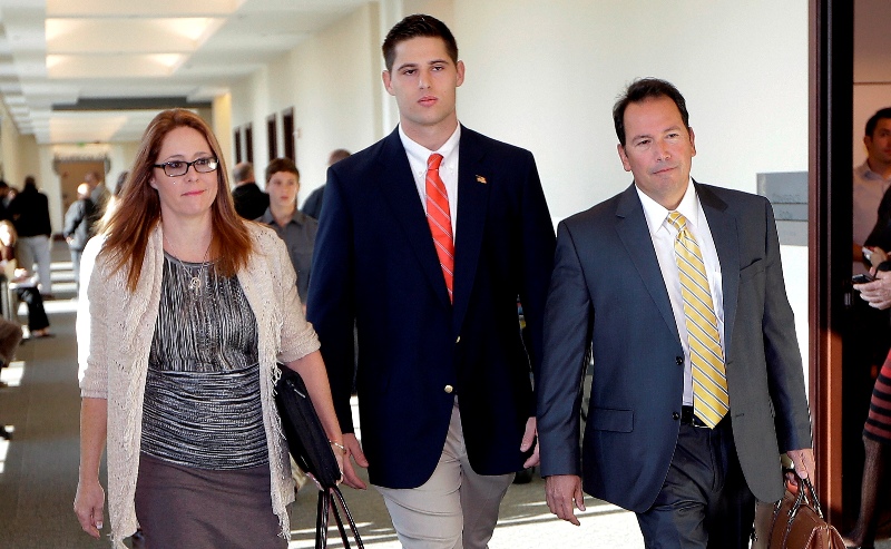 Former Vanderbilt University football player Brandon Vandenburg, center, arrives for jury selection in his trial Monday, Nov. 3, 2014, in Nashville, Tenn. Vandenburg and former teammate Cory Batey are charged with the rape of an unconscious 21-year-old female student on June 23, 2013.