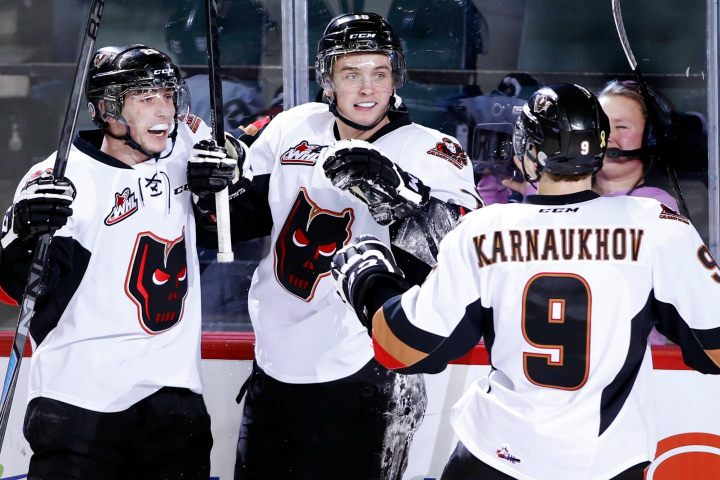 Calgary Hitmen's Jake Virtanen, centre, celebrates his goal against the Swift Current Broncos with Connor Rankin, left, and Pavel Karnaukhov, from Belarus, during WHL hockey action in Calgary, Alberta on Friday, Jan. 23, 2015. 