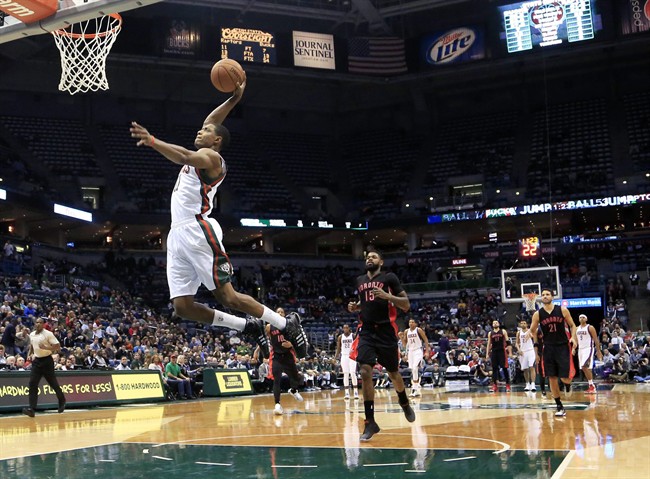 Milwaukee Bucks guard Brandon Knight gets a break away slam dunk against the Toronto Raptors, during the second half of an NBA basketball game Monday, Jan. 19, 2015, in Milwaukee. 