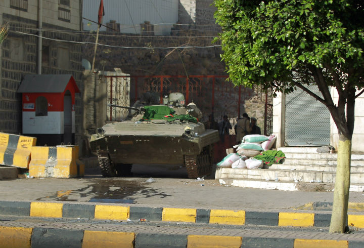 A tank is positioned next to home of Yemeni President Abed Rabbo Mansour Hadi in the capital, Sanaa, on Jan. 21.