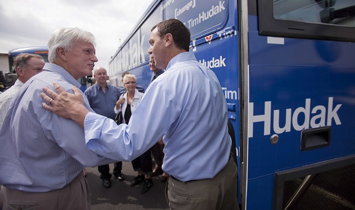 Tim Hudak, right, says goodbye to Rick Nicholls following a campaign stop at J.B. Coatings in Chatham Ontario, Tuesday, September 13, 2011.