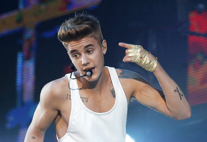 In this March 19, 2013 file photo, Justin Bieber performs during a concert at Bercy Arena in Paris. 