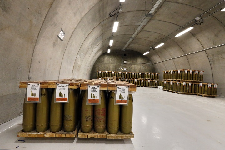 In this Jan. 29, 2015 photo, inert simulated 155mm chemical munitions used for training are stored on pallets inside a hardened hangar at the Pueblo Chemical Depot, east of Pueblo, in southern Colorado.