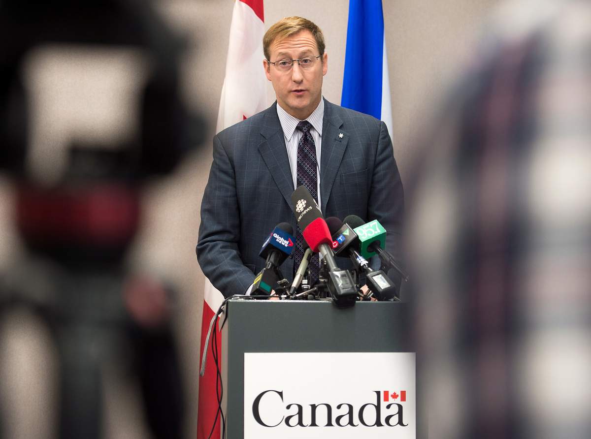 Justice Minister Peter MacKay addresses a news conference, regarding a foiled mass murder plan, in Halifax on Saturday, Feb. 14, 2015. MacKay said the plot to carry out the killings in a public place was not linked to terrorism.