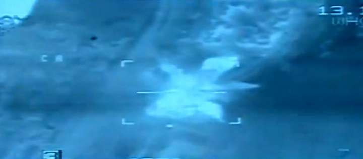 This Feb. 16, 2015 file video image from aerial footage released by the Egyptian Defense Ministry shows an airstrike on Islamic State group positions in Libya. 