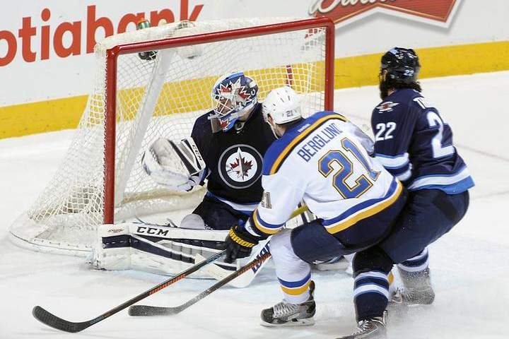 Patrik Berglund of the St. Louis Blues shoots the puck over the glove hand of goaltender Michael Hutchinson of the Winnipeg Jets for a second-period goal on Thursday at the MTS Centre.