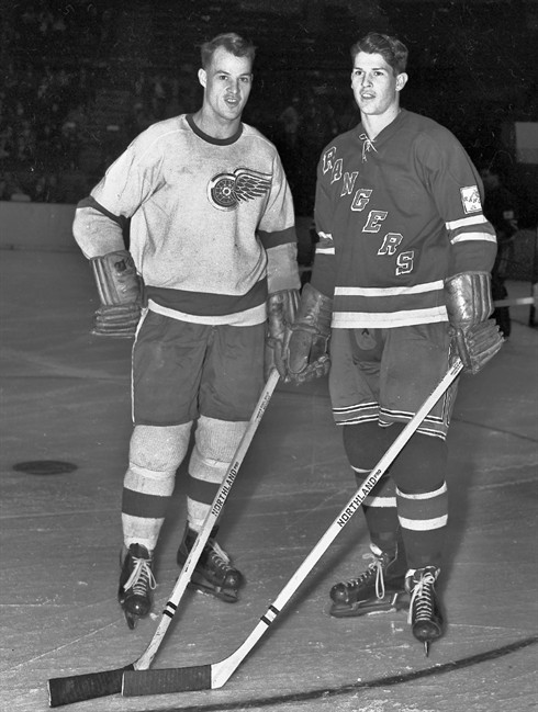 In this Jan. 3, 1951 file photo, Detroit Red Wings' Gordie Howe, left, and his brother, New York Rangers' Vic Howe, pose for a photo before an NHL hockey game at Madison Square Garden in New York. Vic Howe, Gordie Howe's younger brother and a former NHL player with the Rangers, died Saturday, Jan. 31, 2015, in Moncton, New Brunswick, said Helen Cummine, the Howes' sister. He was 85. (AP Photo/File)