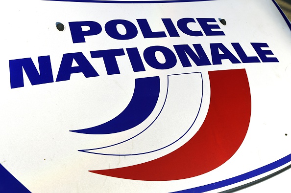 A photo taken on November 5, 2014 shows the logo of the National Police on the bonnet of a Police car.