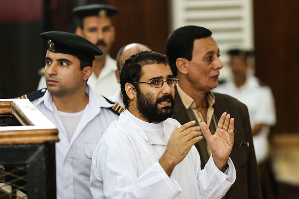 Alaa Abdel-Fattah (Front), one of the 25 detained activists of January 25 Revolution in Egypt, is seen during the Shura Council trials at the Cairo Police Academy in Cairo, Egypt, on November 11, 2014.