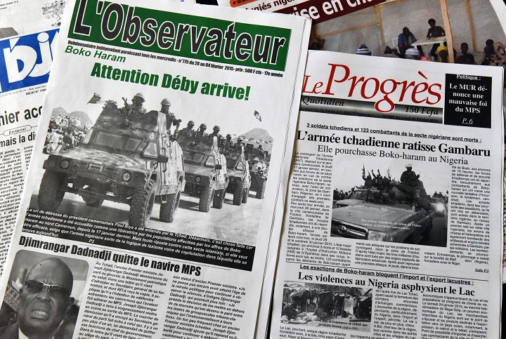 Chadian newspapers with headlines pertaining to Chad's military intervention against Nigerian Islamist group Boko Haram displayed on February 2, 2015 in N'Djamena.
