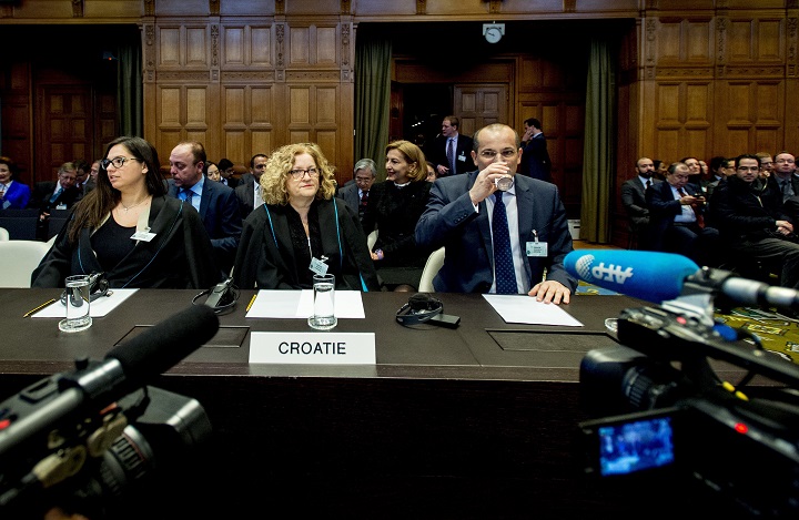 From left: Croatians Jana Spero of the Justice Ministry, University of Rijeka professor Vesna Crnic-Grotic and Justice Minister Orsat Miljenic sit on February 3, 2015 in the courtroom of the International Court of Justice (ICJ) in The Hague as the UN's highest courtbefore started to hand down its verdict in a long-running genocide case, seen as a landmark decision that could re-open old wounds between former foes Croatia and Serbia. 