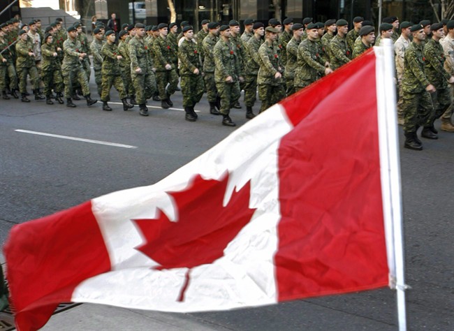 Members of Canada's military parade through downtown Calgary,.