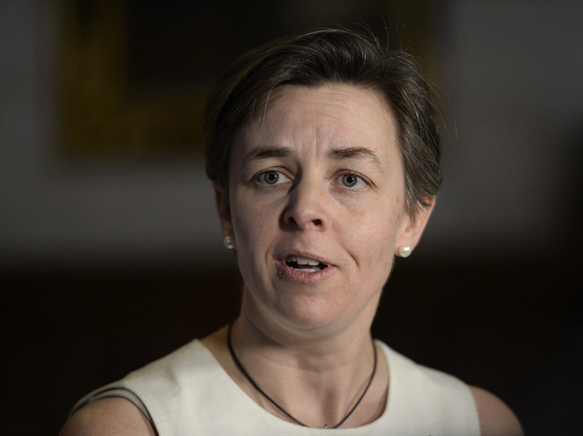 Labour Minister Kellie Leitch updates the media on the Canadian Pacific Rail labour situation in the foyer in the House of Commons in Ottawa on Monday, Feb. 16, 2015.