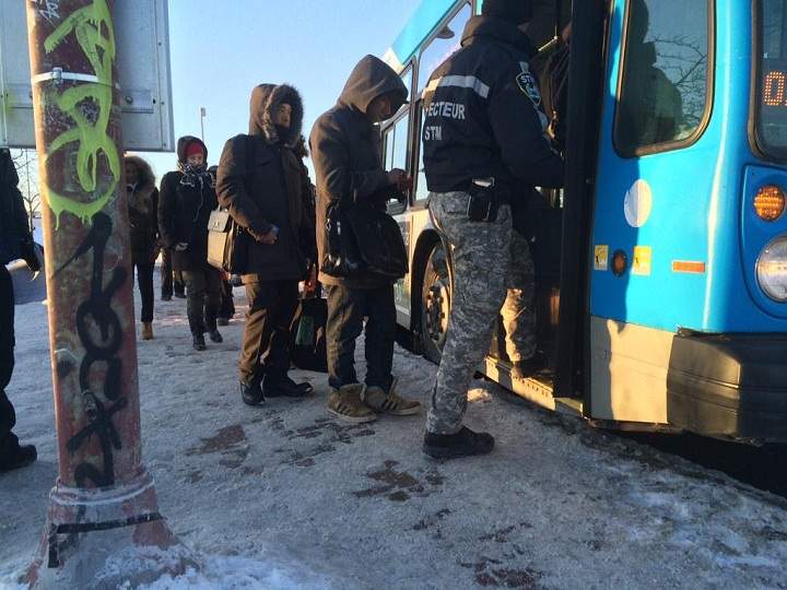The CP Rail strike action has affected Montreal commuters, pictured here waiting for replacement buses on February 16, 2015.