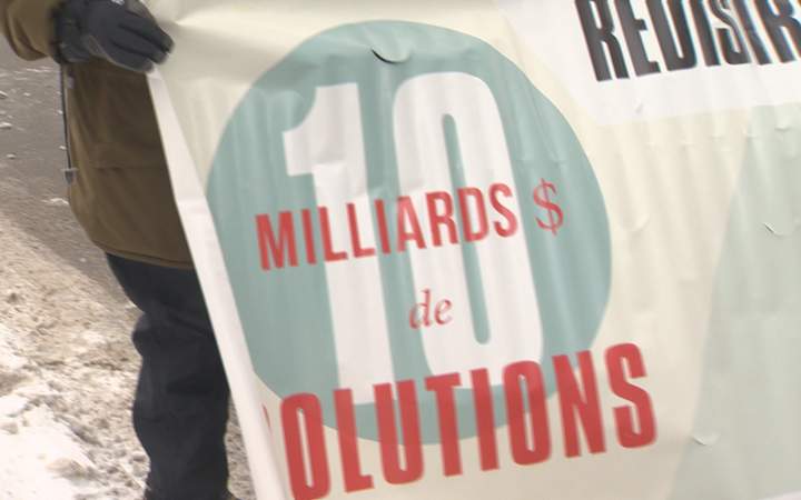 A few hundred demonstrators marched through downtown Montreal as part of a series of “disruptive actions” protesting the Quebec government's planned austerity measures on Monday, February 23, 2015.