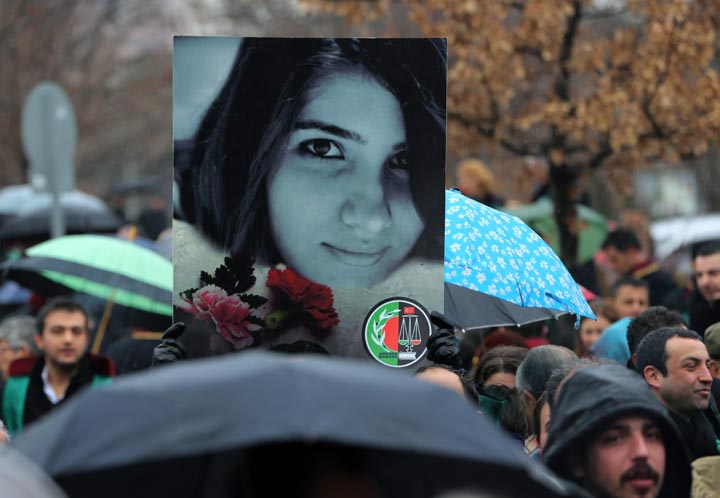 Thousands members of Turkey's Bar Associations with one holding a poster of Ozgecan Aslan, 20, a student whose body was found Friday in Mersin in southern Turkey, march to the parliament in Ankara, Turkey, Monday, Feb. 16, 2015.