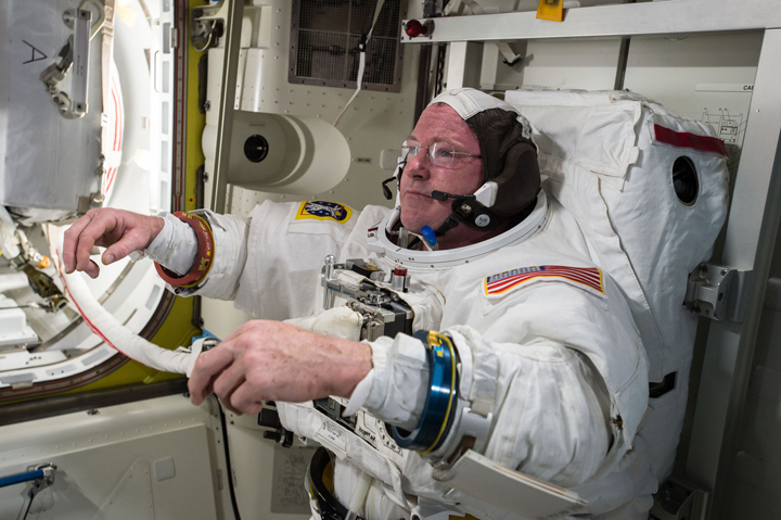 U.S. astronaut Barry “Butch” Wilmore checks out his spacesuit in preparation for an extravehicular activity (EVA) or spacewalk.