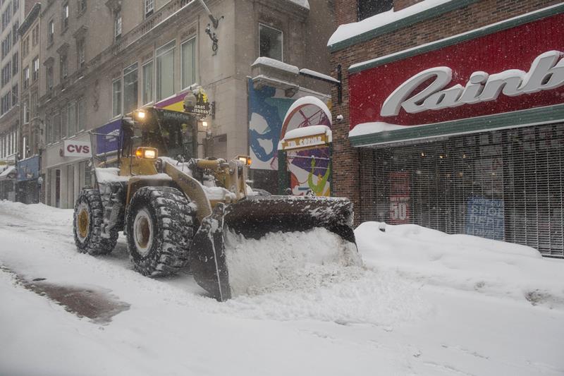 A front loader plows the Downtown Crossing area during winter storm Neptune which dropped over a foot of snow February 15, 2015 in Boston, Massachusetts.