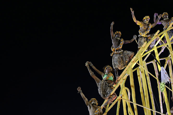 Performers from the Imperatriz Leopoldinense samba school parade on a float during carnival celebrations at the Sambadrome in Rio de Janeiro, Brazil, Tuesday, Feb. 17, 2015. 