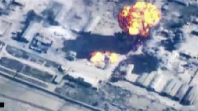 In this image made from undated video provided by Jordanian military via Jordan TV, explosions go off as the military carried out airstrikes at an undisclosed location in Syria.