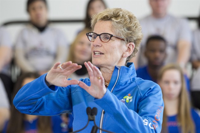 Ontario Premier Kathleen Wynne addresses guests as she attends an event to mark the 2015 PanAm games in Toronto on Friday, February 20, 2015. 