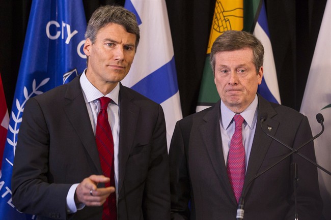 Toronto Mayor John Tory (right) stands with Vancouver Mayor Gregor Robertson as they speak to the press during the Big Cities summit hosted by the Federation of Canadian Municipalities in Toronto on Thursday February 5 2015.