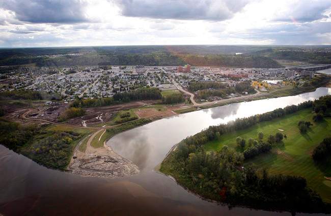 The city at the heart of Canada's oilsands is no ghost town, but things have slowed down a bit in Fort McMurray, Alta. An aerial view of Fort McMurray is shown in this Monday, Sept. 19, 2011 photo. THE CANADIAN PRESS/Jeff McIntosh.