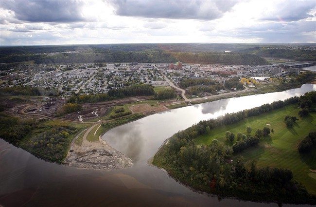 The city at the heart of Canada's oilsands is no ghost town, but things have slowed down a bit in Fort McMurray, Alta. An aerial view of Fort McMurray is shown in this Monday, Sept. 19, 2011 photo. THE CANADIAN PRESS/Jeff McIntosh.