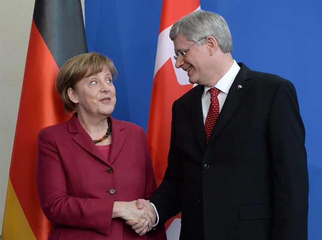 Prime Minister Stephen Harper take part in a joint press conference with German Chancellor Angela Merkel at the Chancellery in Berlin, Germany on Thursday, March 27, 2014. 