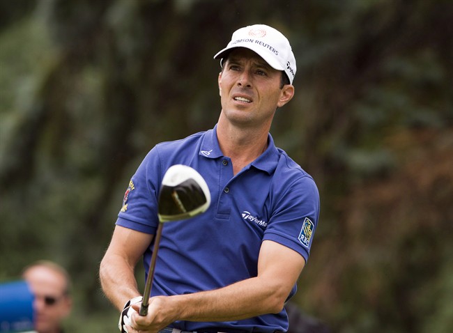 Mike Weir, from Bright's Grove, Ont., tees off during final round play at the Canadian Open golf championship Sunday, July 27, 2014 at Royal Montreal golf club in Montreal.