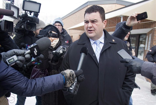 Former Conservative MP Dean Del Mastro talks to media as he leaves court for lunch break at a sentencing hearing in Peterborough Ont., Tuesday, January 27, 2015.