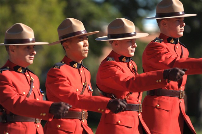 RCMP officers march off the parade grounds following the RCMP National Memorial Service in Regina Sunday, September 12, 2010. 