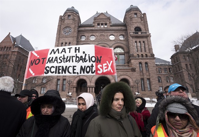 Demonstrators gather in front of Queen's Park to protest against Ontario's new sex education curriculum in Toronto on Tuesday, February 24, 2015.